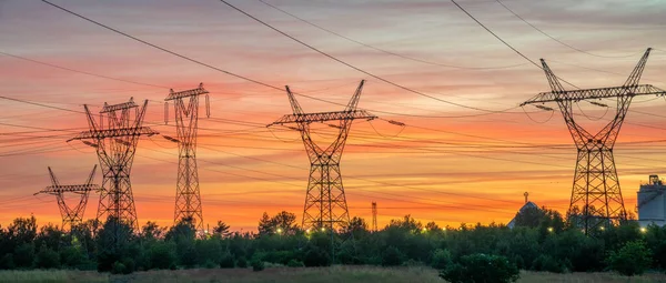 depositphotos 481175998 stock photo high voltage pylons background evening